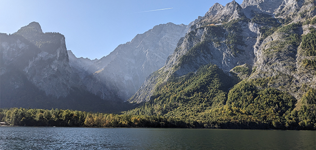 A lake in the foreground with mountains rising up in the background